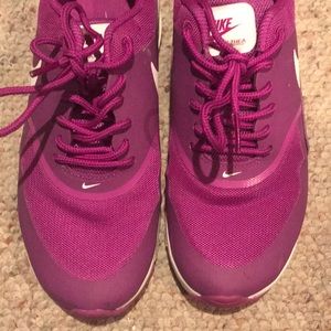 Purple Nike running shoes